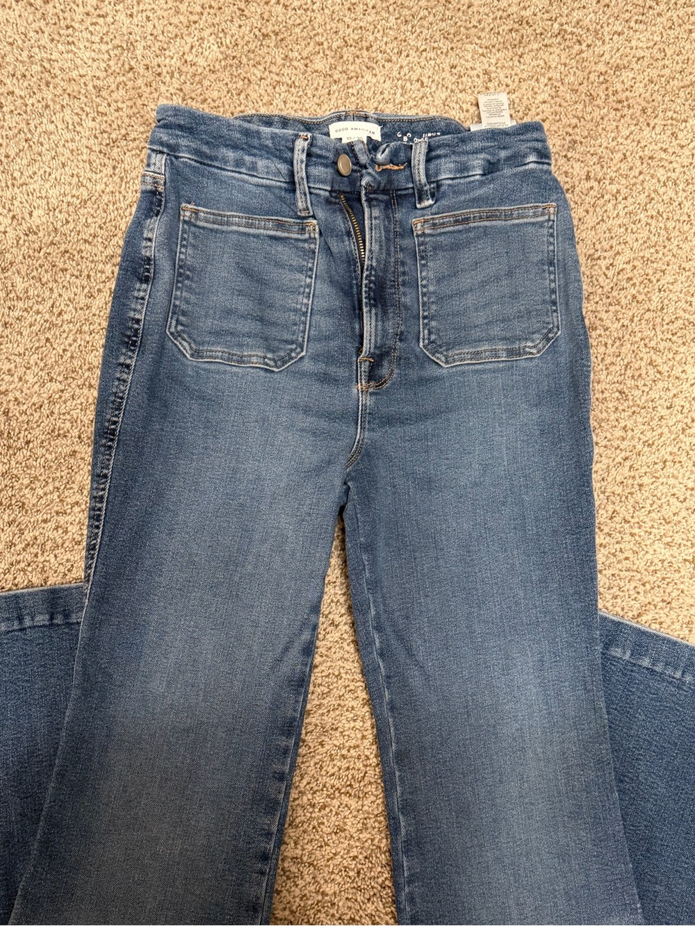 Good American boot cut High-Rise Jeans in Medium Blue